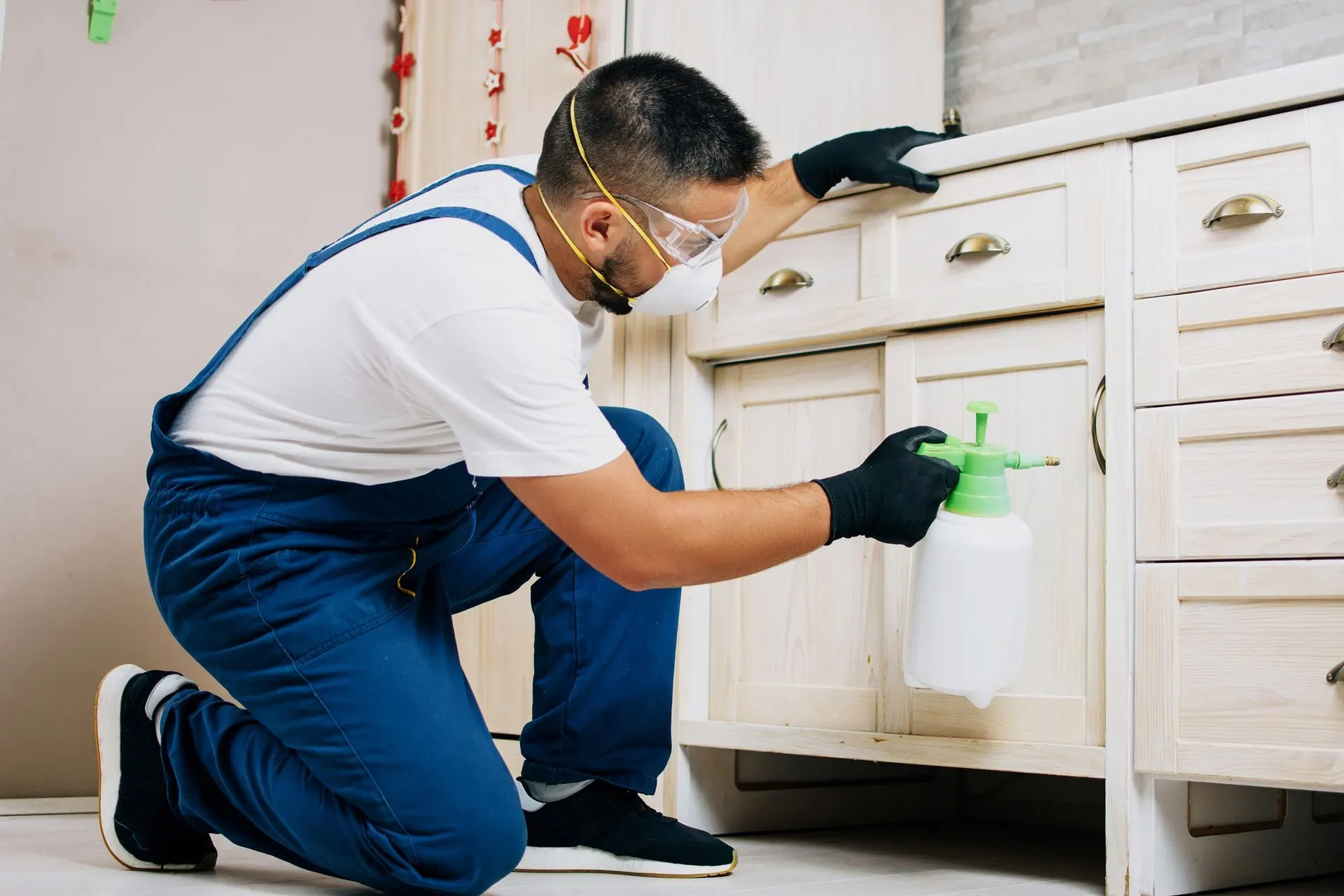 Empire Pest Control technician in full safety gear before starting a job